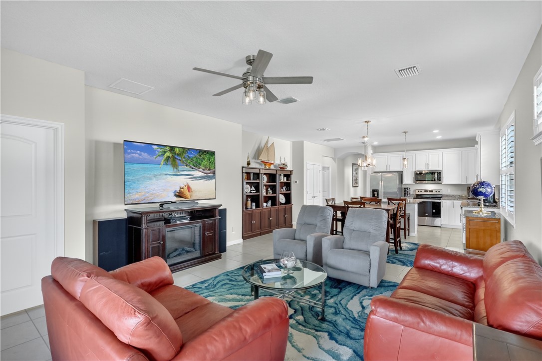5130 Unity Square Vero Beach, FL 32967 - Photo 6 of 36 a living room with furniture kitchen view and a window