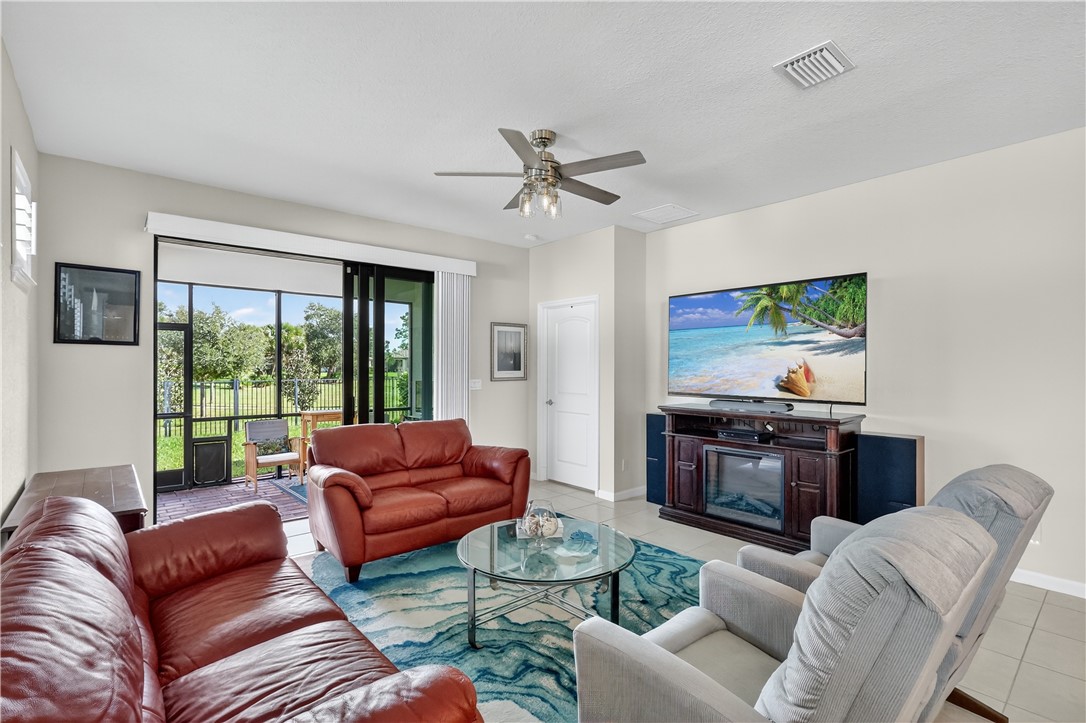 5130 Unity Square Vero Beach, FL 32967 - Photo 7 of 36 a living room with furniture or couch and a large window