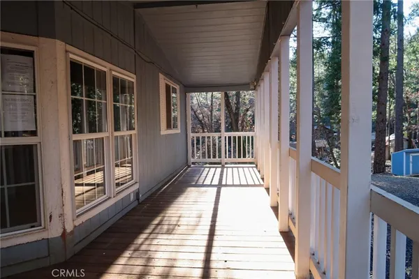a view of a balcony with wooden floor