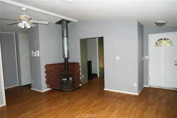 a living room with furniture and a mirror