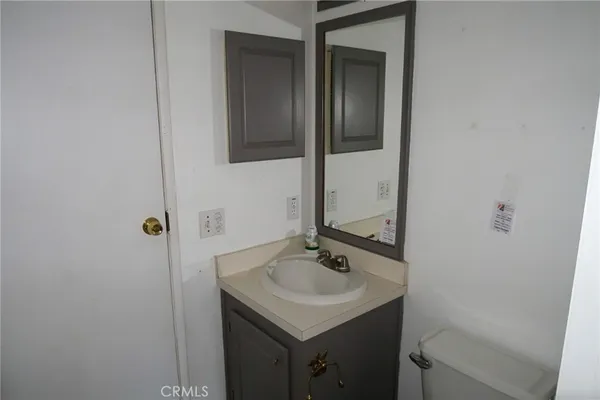 a bathroom with a sink and mirror