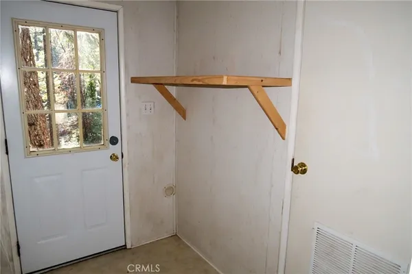 a view of a hallway with windows