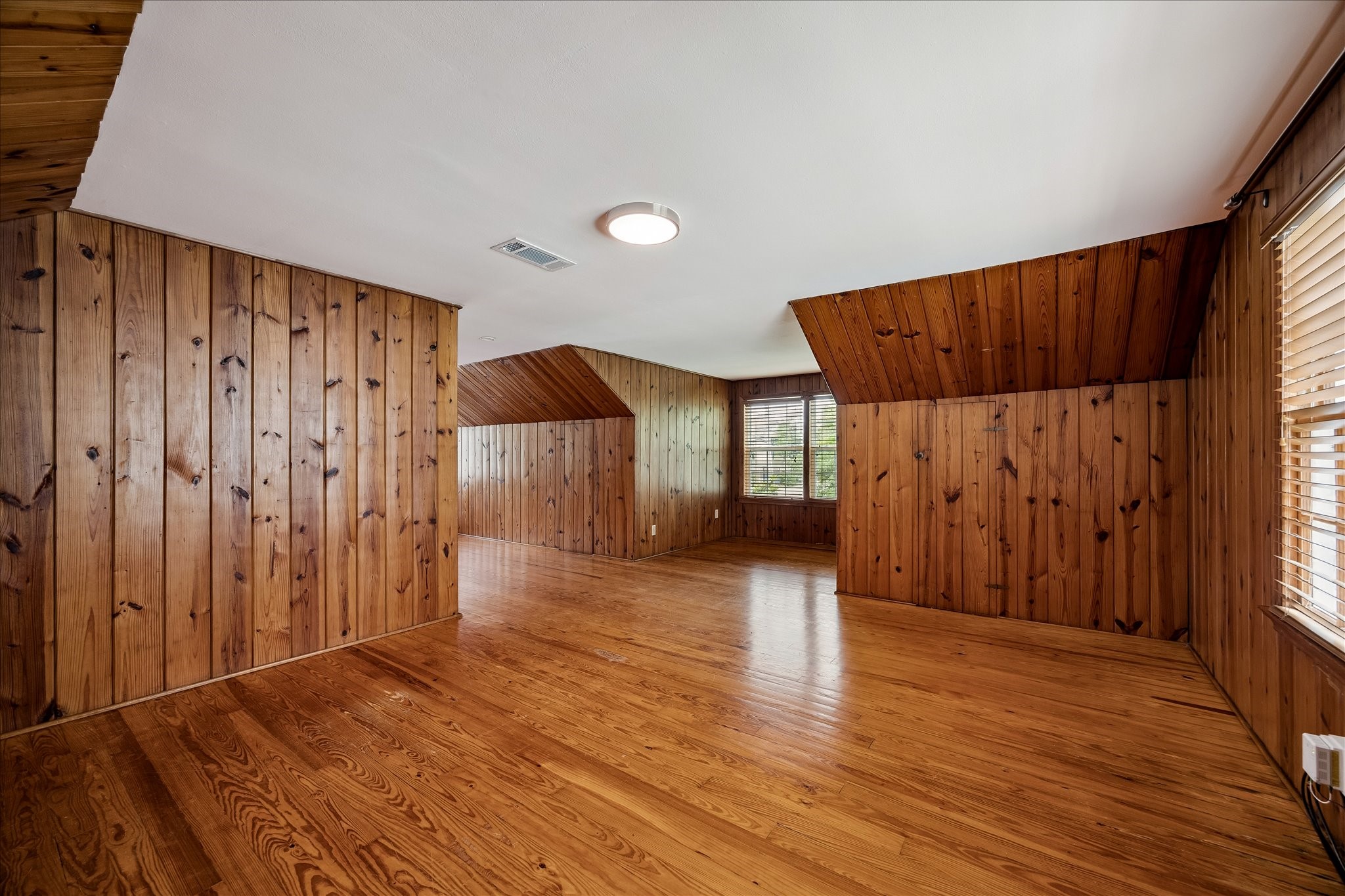 2202 Colquitt Street Houston, TX 77098 - Photo 11 of 19 a view of a room with wooden floor and a window