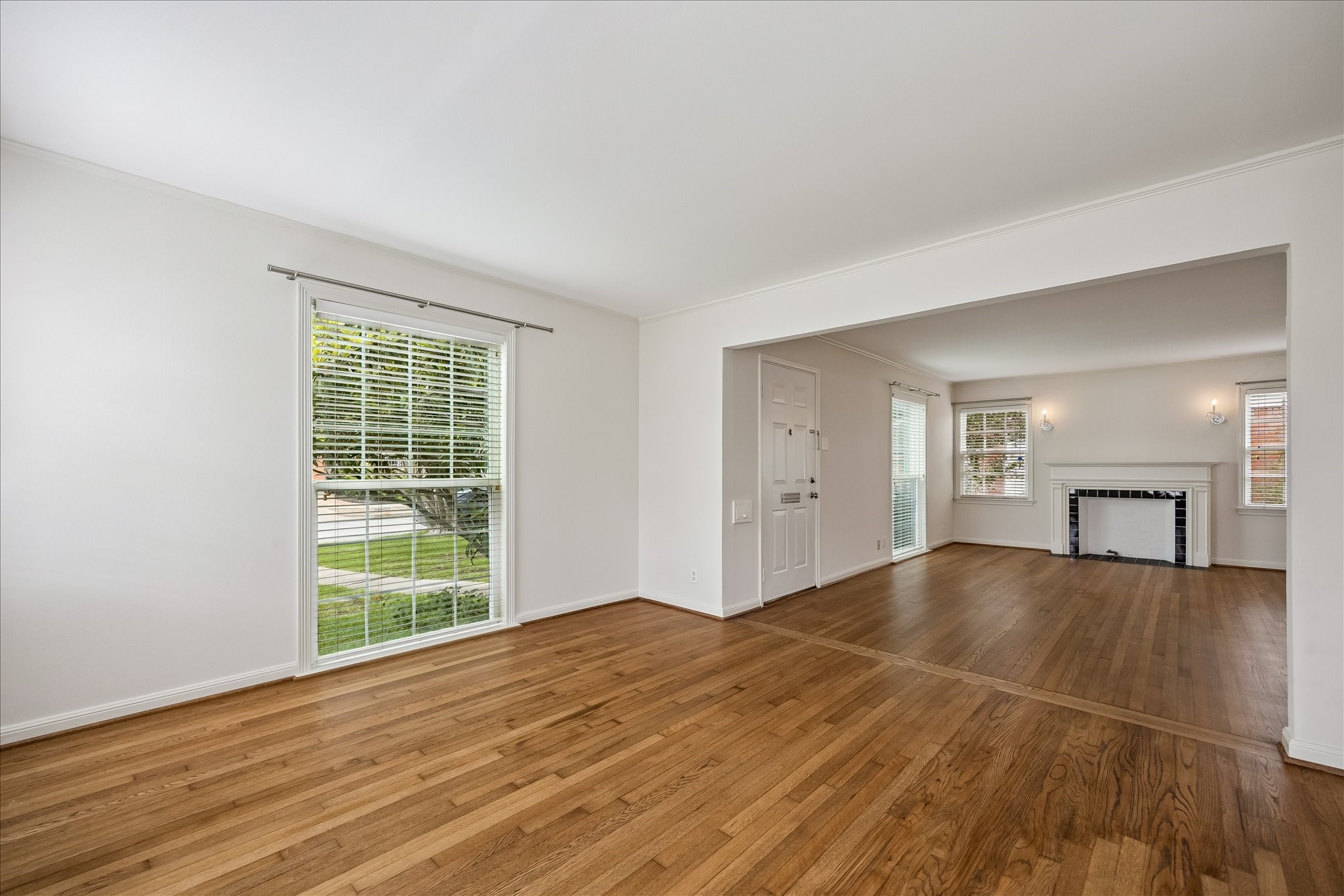 2202 Colquitt Street Houston, TX 77098 - Photo 3 of 19 a view of empty room with wooden floor and fan