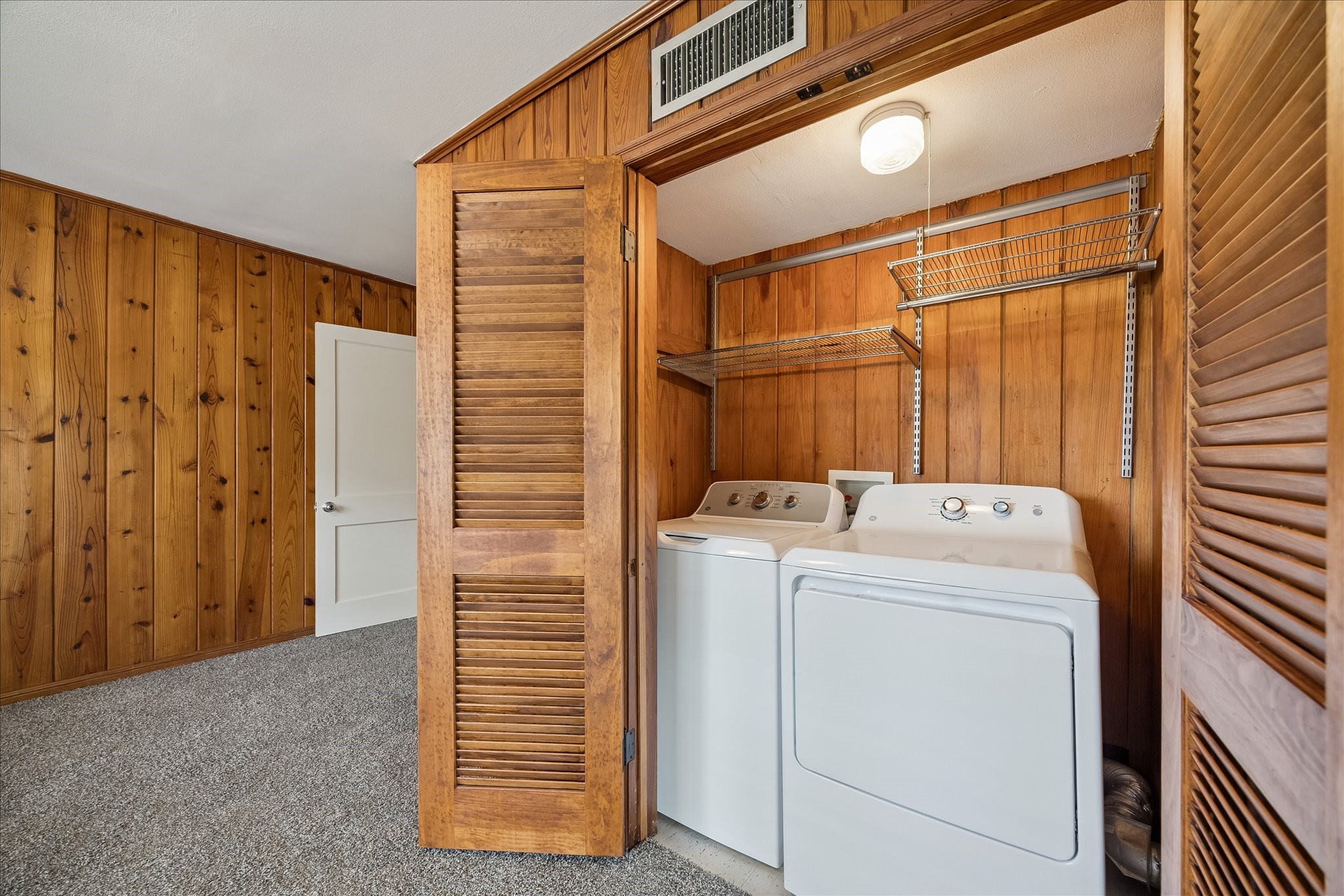 2202 Colquitt Street Houston, TX 77098 - Photo 8 of 19 a view of storage and utility room with washer and dryer