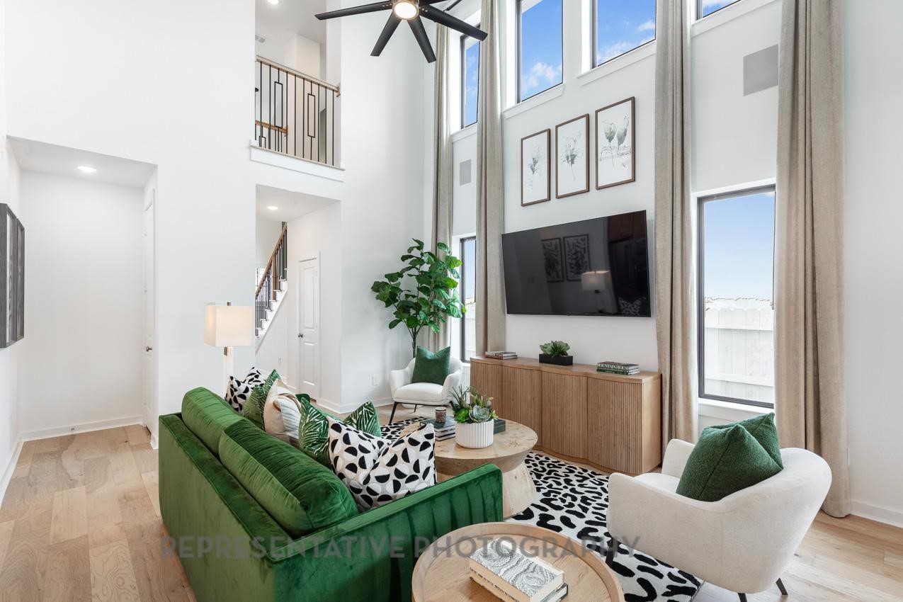 5327 Mango Blfs Street Manvel, TX 77578 - Photo 16 of 46 a living room with furniture and a flat screen tv