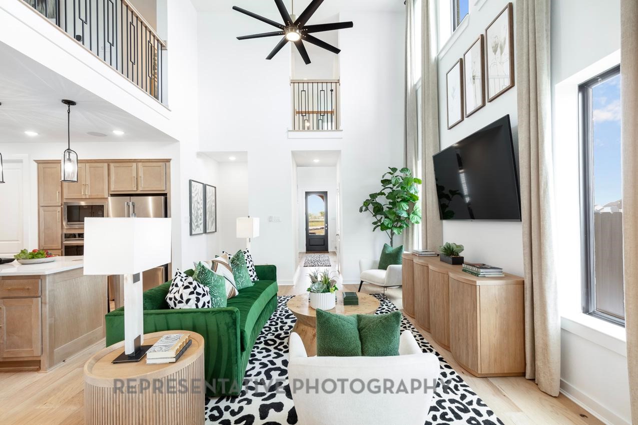 5327 Mango Blfs Street Manvel, TX 77578 - Photo 18 of 46 a living room with furniture and a flat screen tv