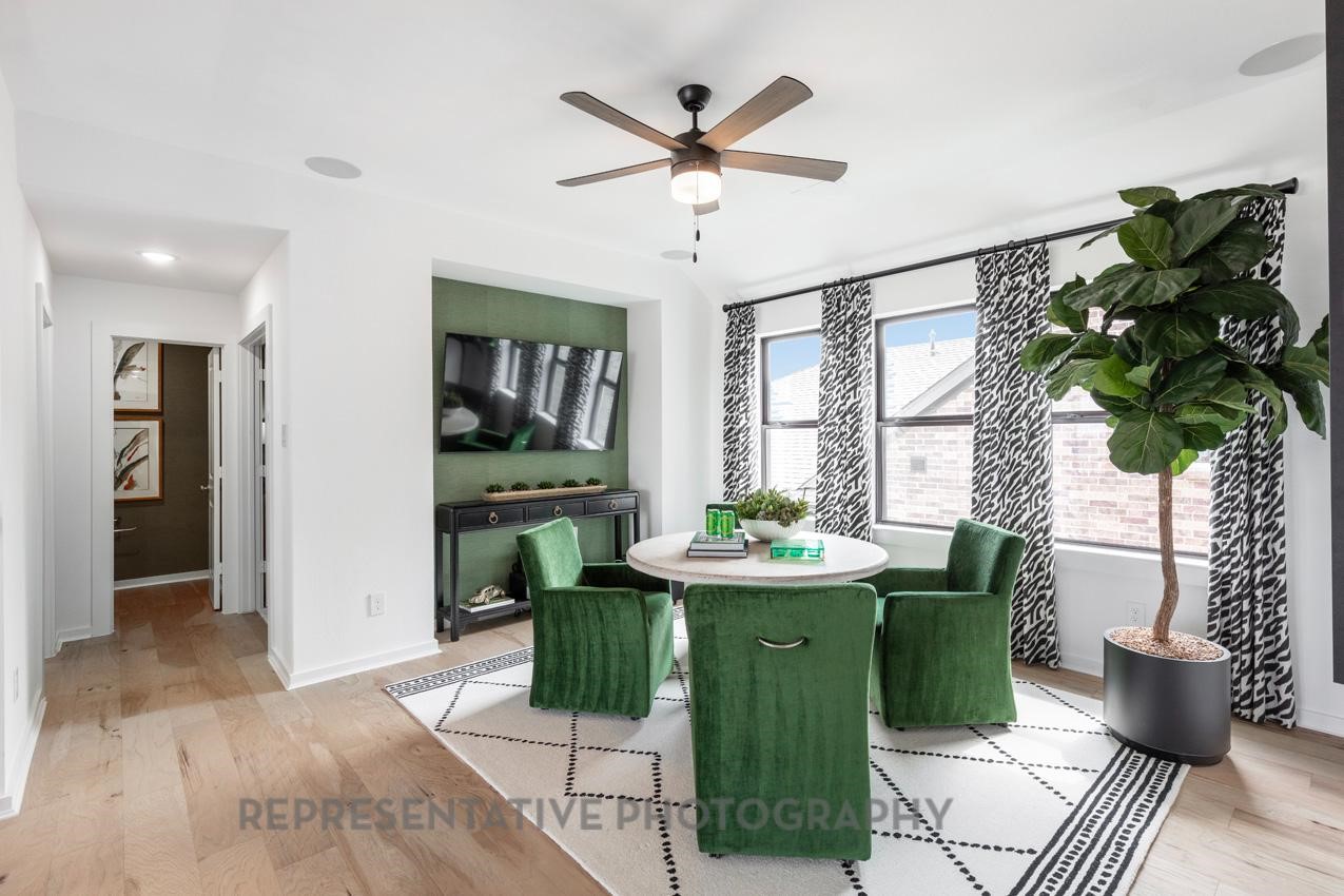 5327 Mango Blfs Street Manvel, TX 77578 - Photo 25 of 46 a living room with furniture and potted plants