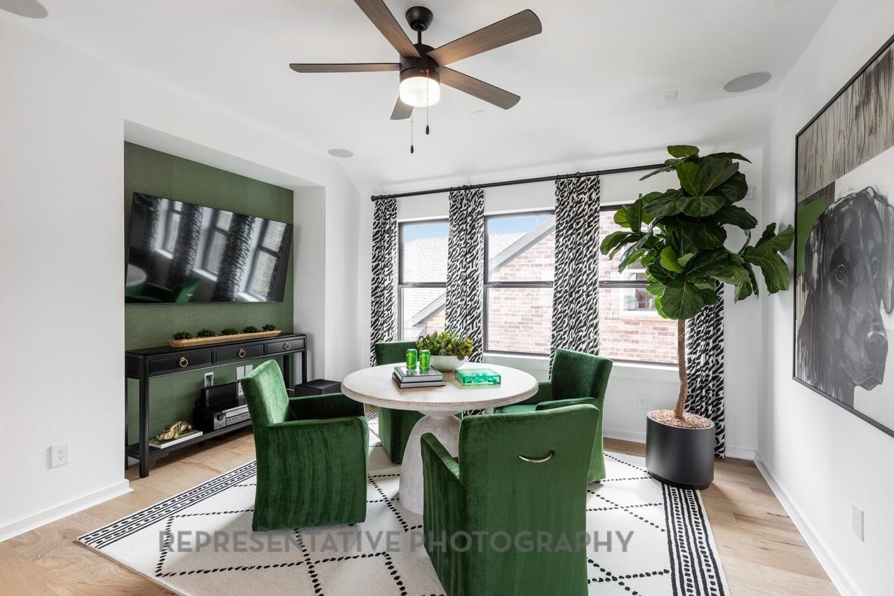5327 Mango Blfs Street Manvel, TX 77578 - Photo 26 of 46 a dining room with furniture and a potted plant
