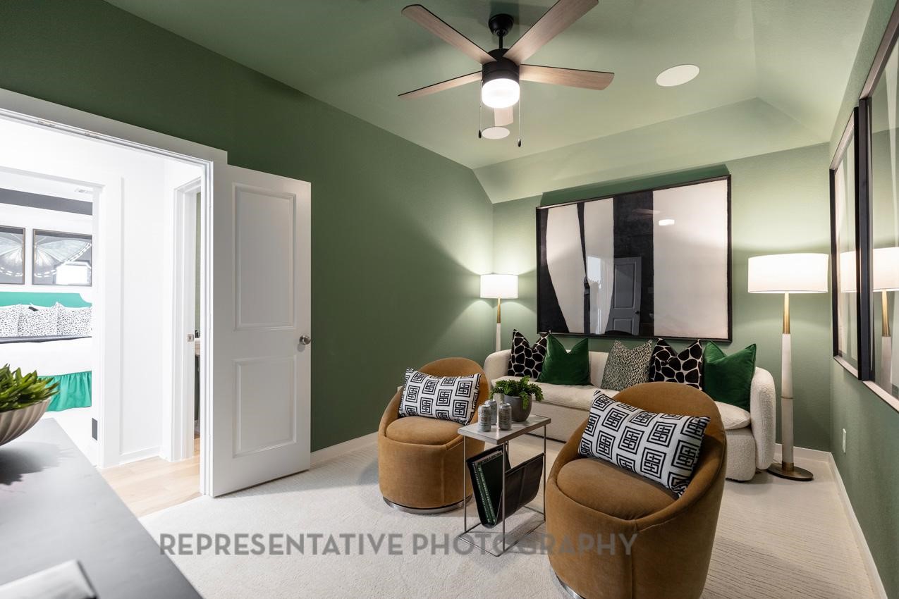 5327 Mango Blfs Street Manvel, TX 77578 - Photo 28 of 46 a living room with furniture and a chandelier