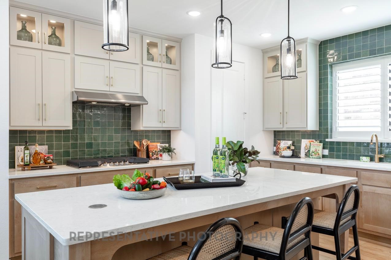 5327 Mango Blfs Street Manvel, TX 77578 - Photo 5 of 46 a kitchen with stainless steel appliances a sink and cabinets