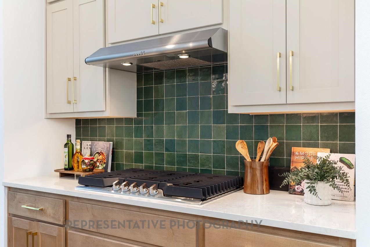 5327 Mango Blfs Street Manvel, TX 77578 - Photo 10 of 46 a kitchen with a sink and cabinets