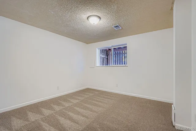 a view of a house with wooden deck