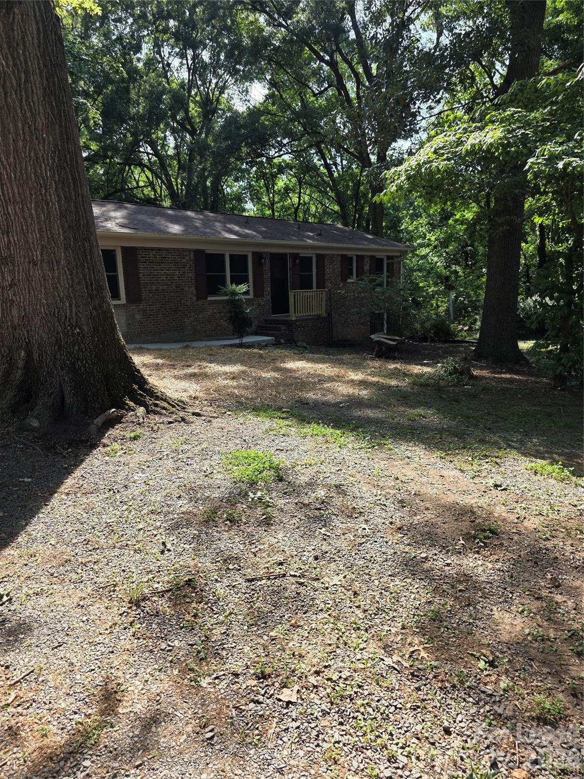 5710 Unionville Road Monroe, NC 28110 - Photo 2 of 18 a view of a house with backyard and a tree