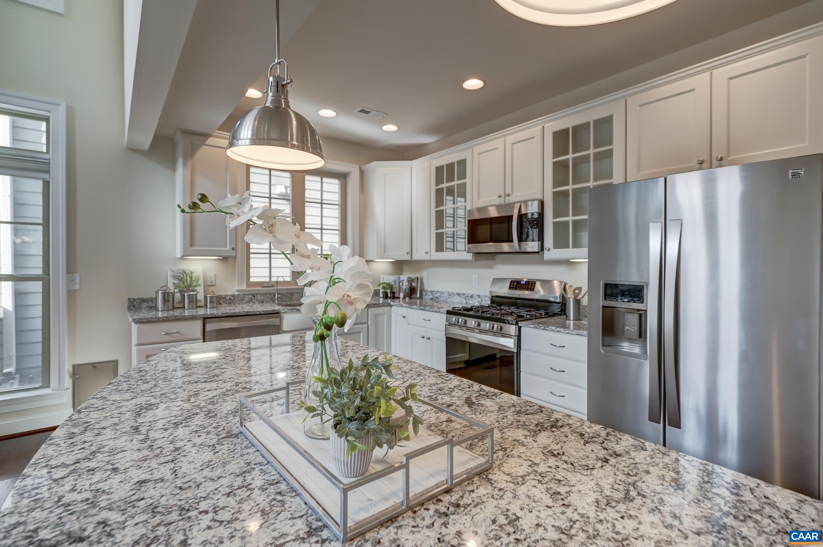 804 Golf View Drive Crozet, VA 22932 - Photo 13 of 62 a kitchen with stainless steel appliances granite countertop a refrigerator stove microwave and sink