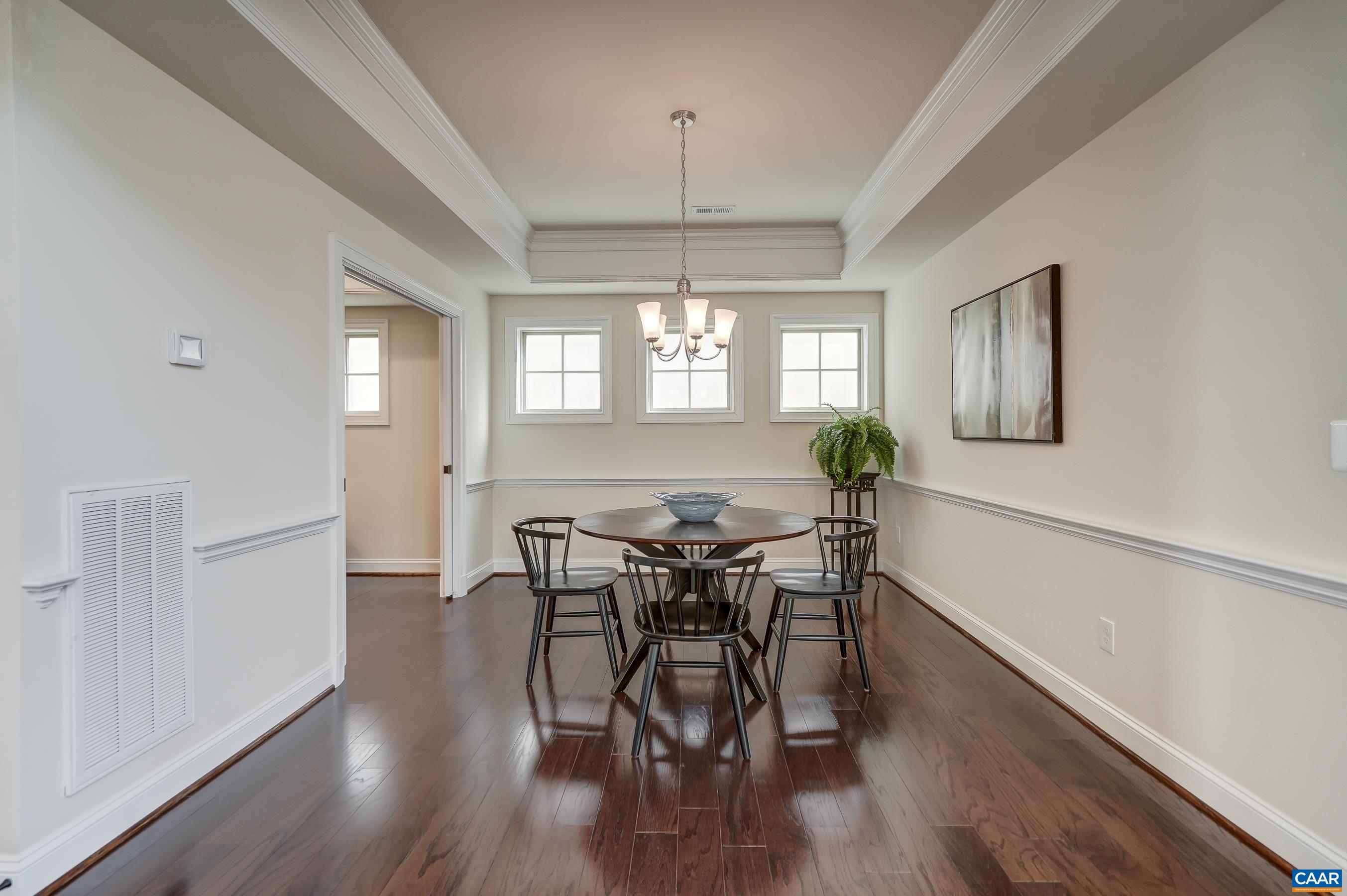 804 Golf View Drive Crozet, VA 22932 - Photo 20 of 62 a view of a dining room with furniture window and wooden floor