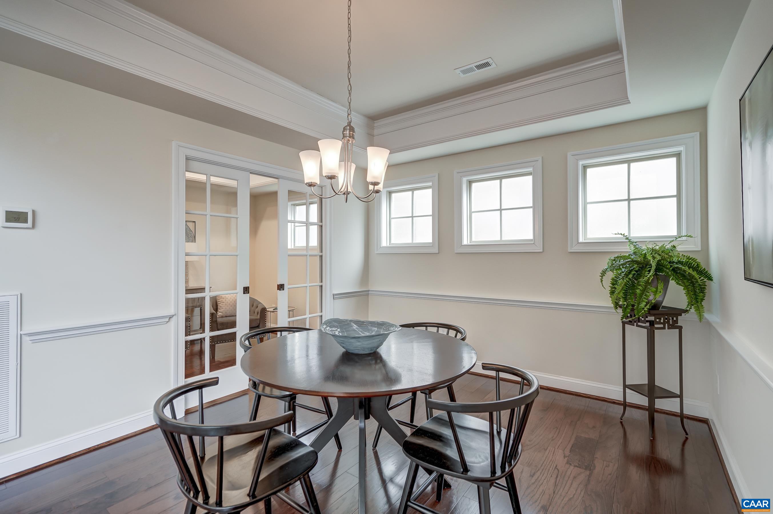 804 Golf View Drive Crozet, VA 22932 - Photo 22 of 62 a view of a dining room with furniture window and wooden floor