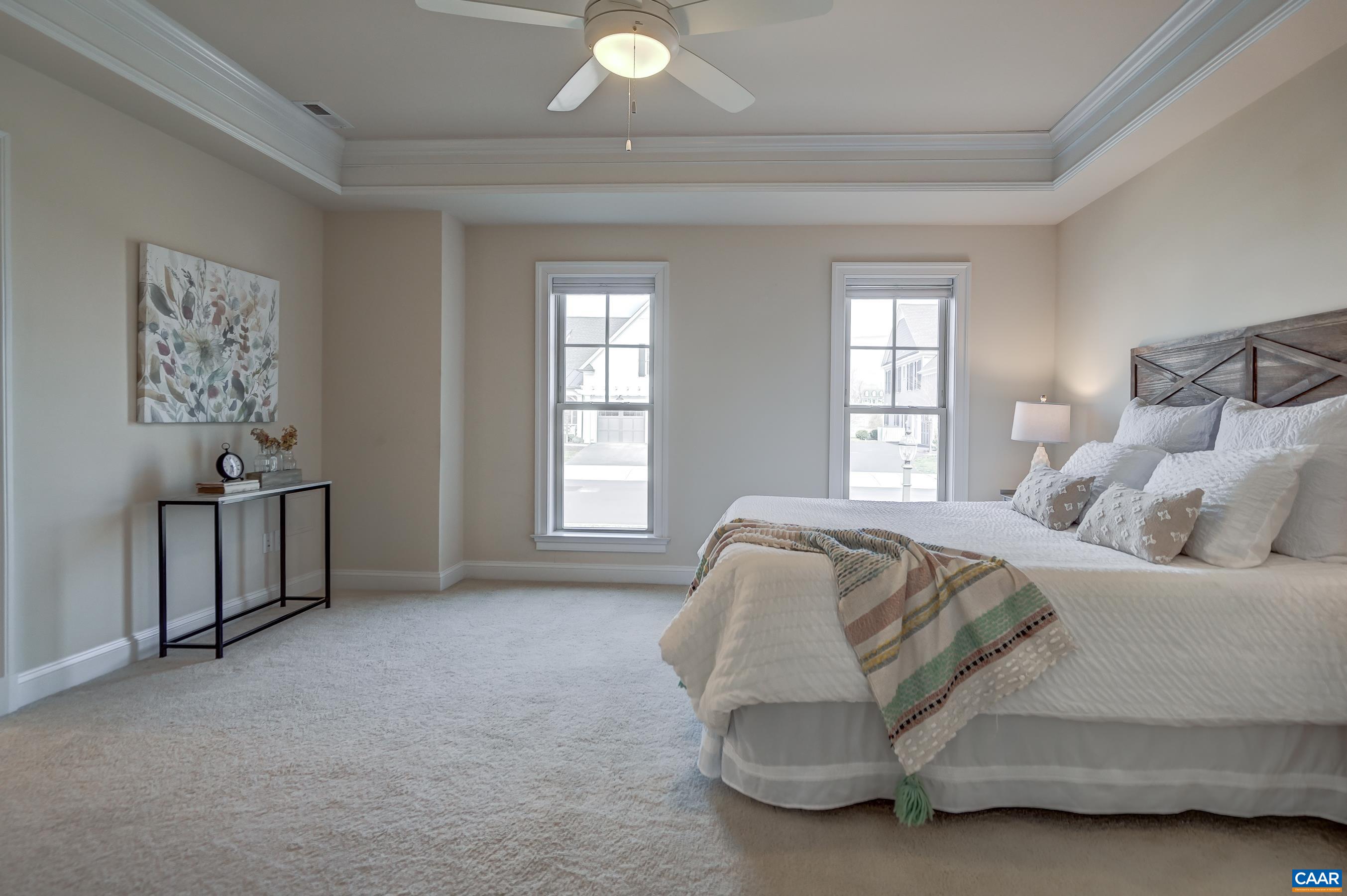 804 Golf View Drive Crozet, VA 22932 - Photo 26 of 62 a spacious bedroom with a bed and a window