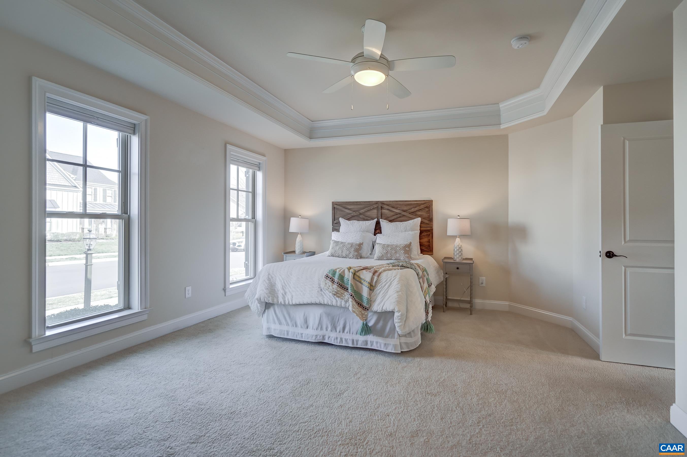 804 Golf View Drive Crozet, VA 22932 - Photo 27 of 62 a bedroom with a large bed and a large window
