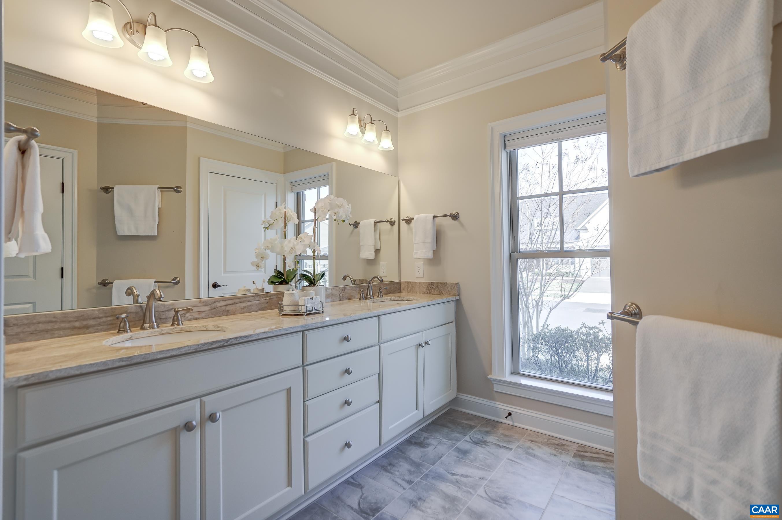 804 Golf View Drive Crozet, VA 22932 - Photo 28 of 62 a bathroom with a granite countertop sink mirror and double