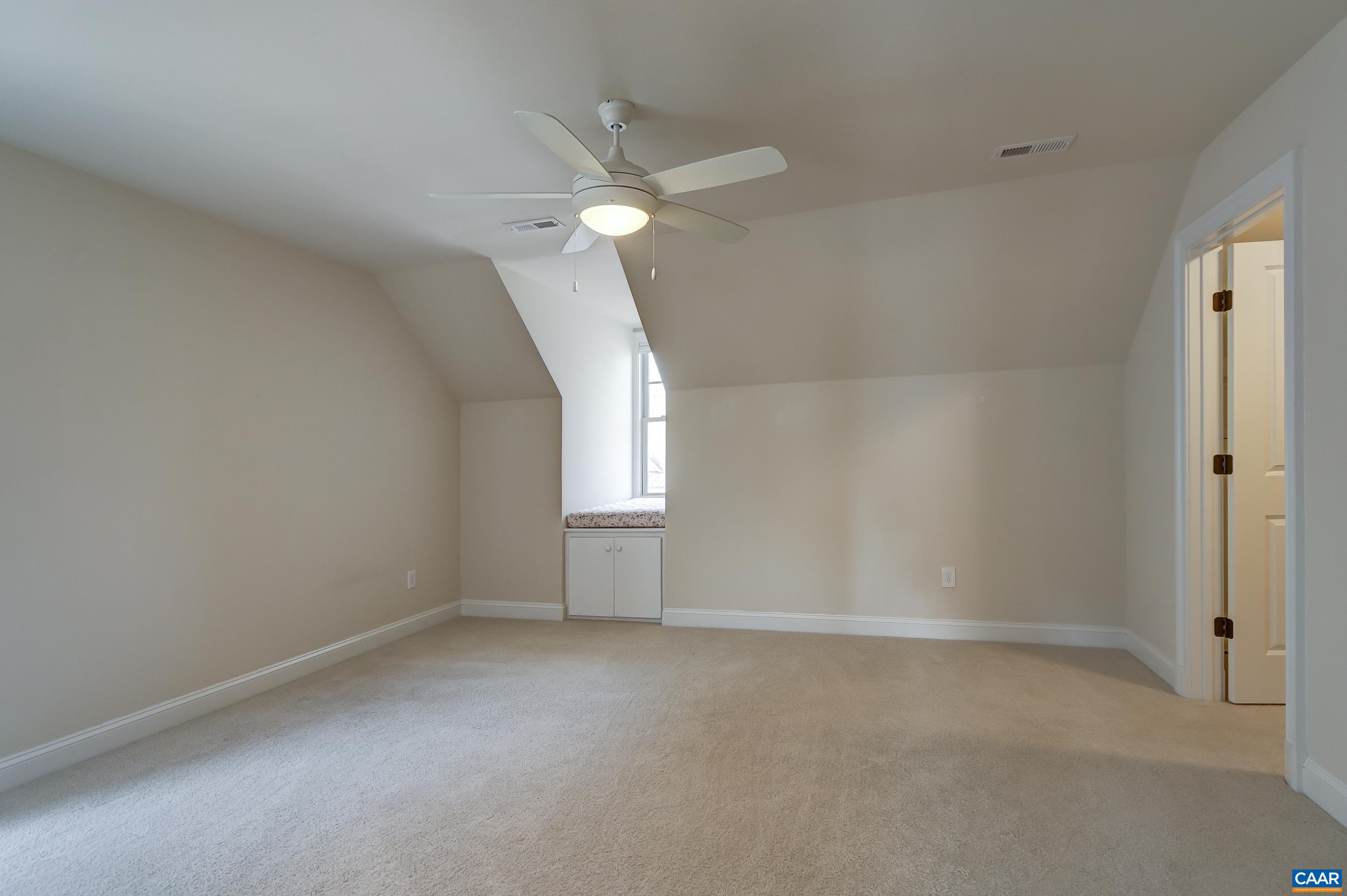 804 Golf View Drive Crozet, VA 22932 - Photo 41 of 62 an empty room with a window and a fan