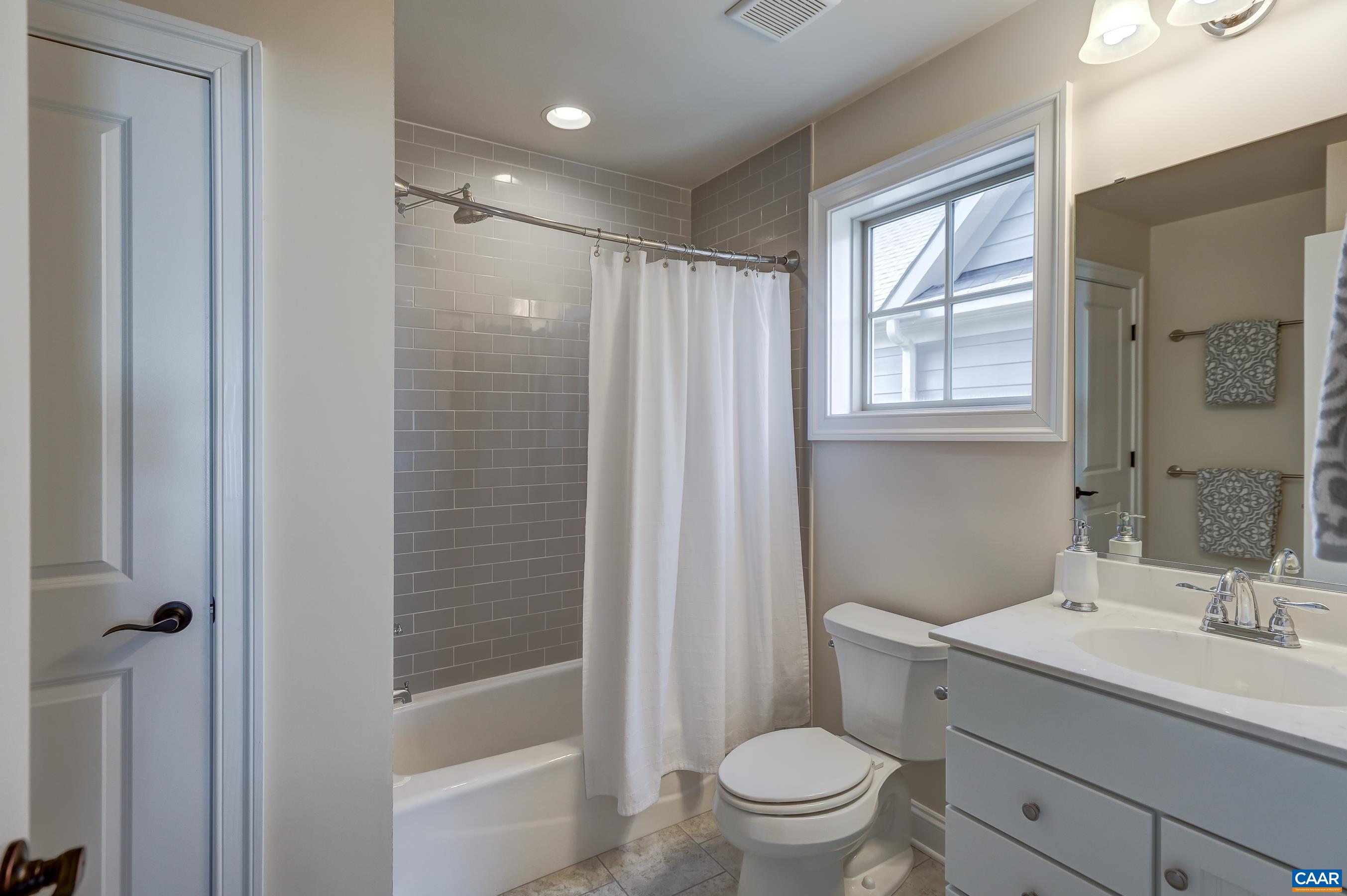 804 Golf View Drive Crozet, VA 22932 - Photo 42 of 62 a bathroom with a granite countertop sink toilet and shower
