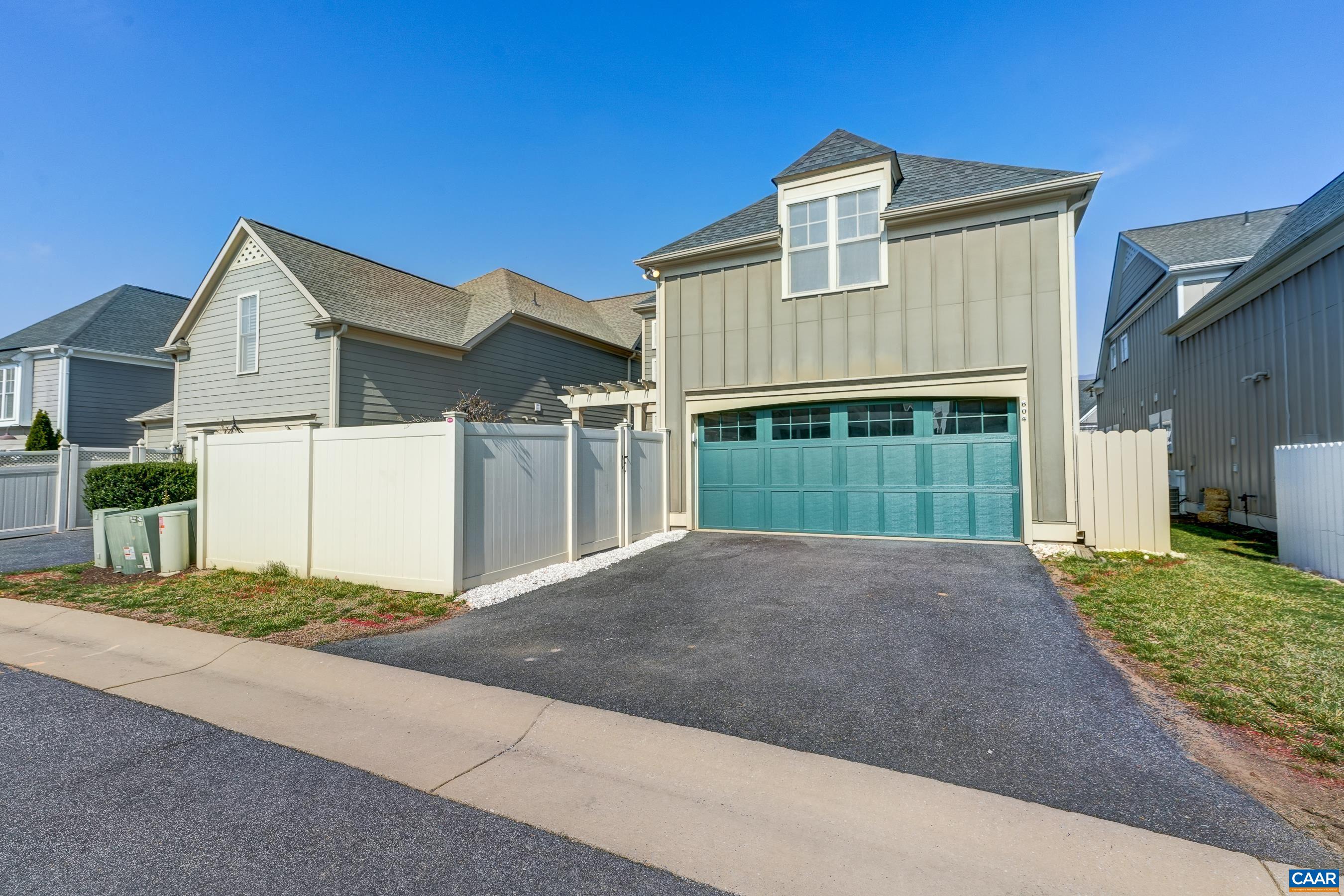 804 Golf View Drive Crozet, VA 22932 - Photo 56 of 62 a front view of a house with a yard and garage