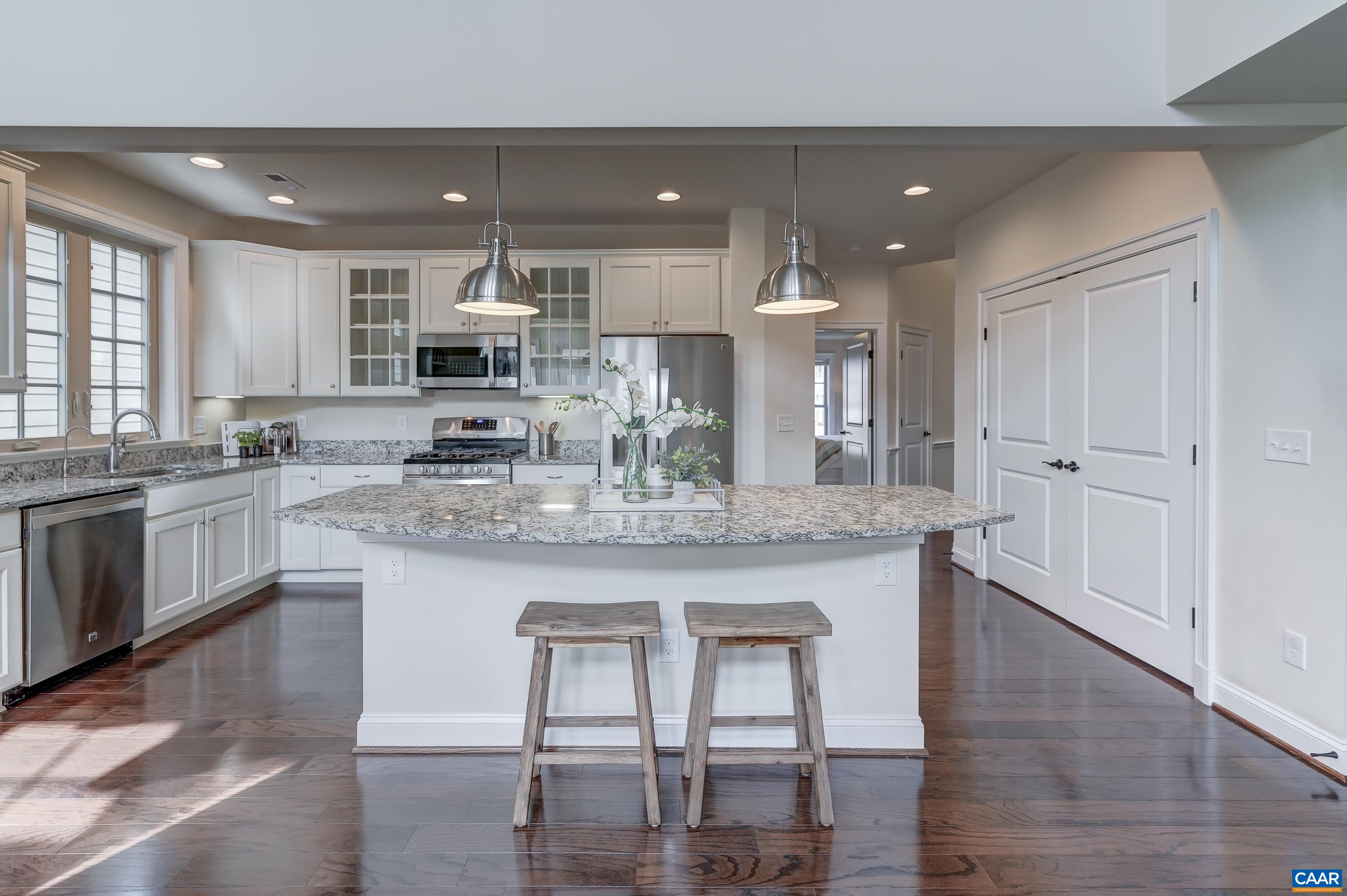 804 Golf View Drive Crozet, VA 22932 - Photo 8 of 62 a large kitchen with granite countertop lots of counter space and stainless steel appliances