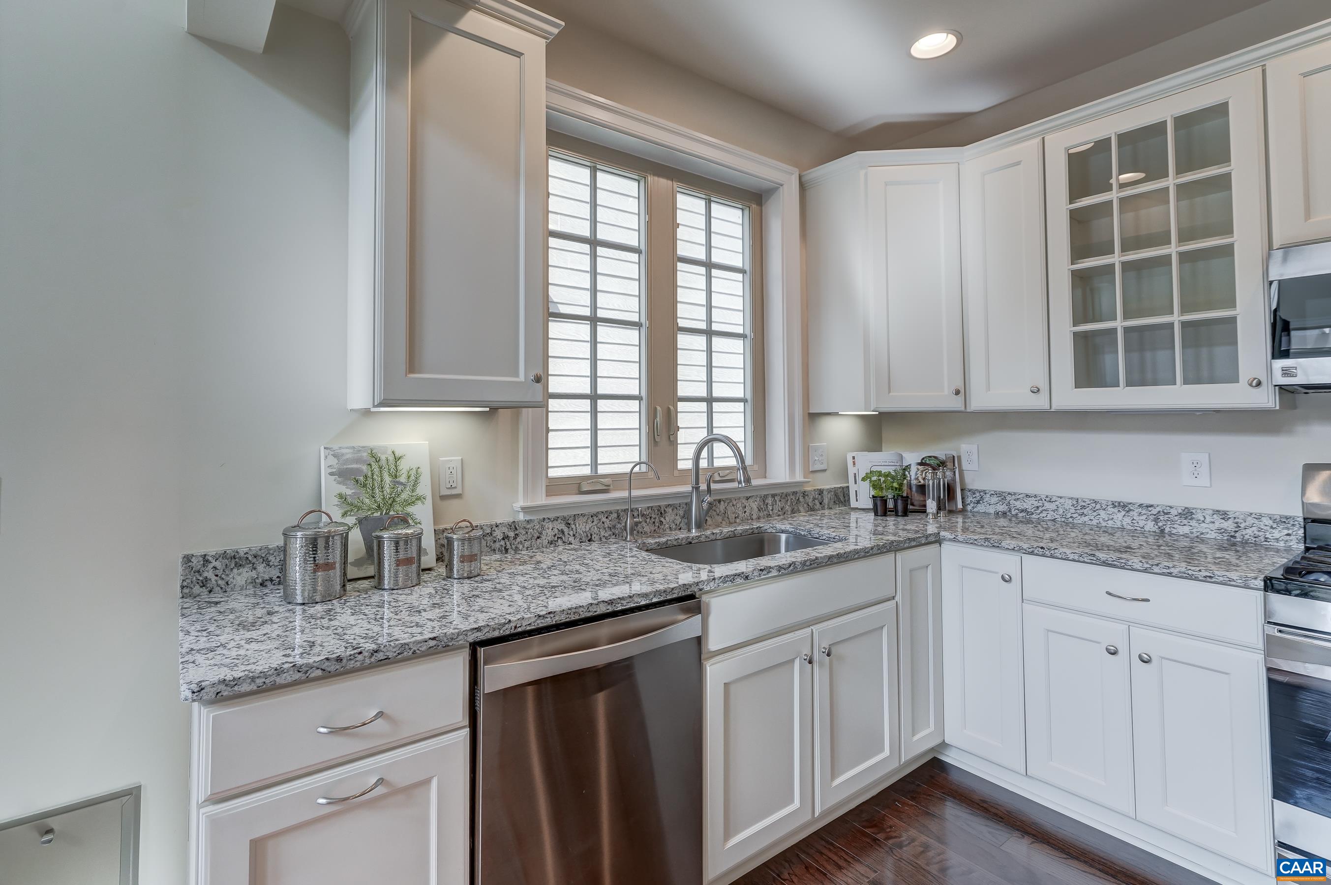 804 Golf View Drive Crozet, VA 22932 - Photo 9 of 62 a kitchen with granite countertop white cabinets and a window