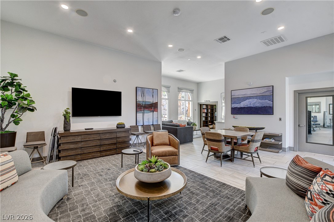 2555 Hampton Road, Unit 2207 Henderson, NV 89052 - Photo 70 of 74 A well-lit communal space with ample seating, featuring an inviting blend of lounge and dining areas for comfortable gatherings.