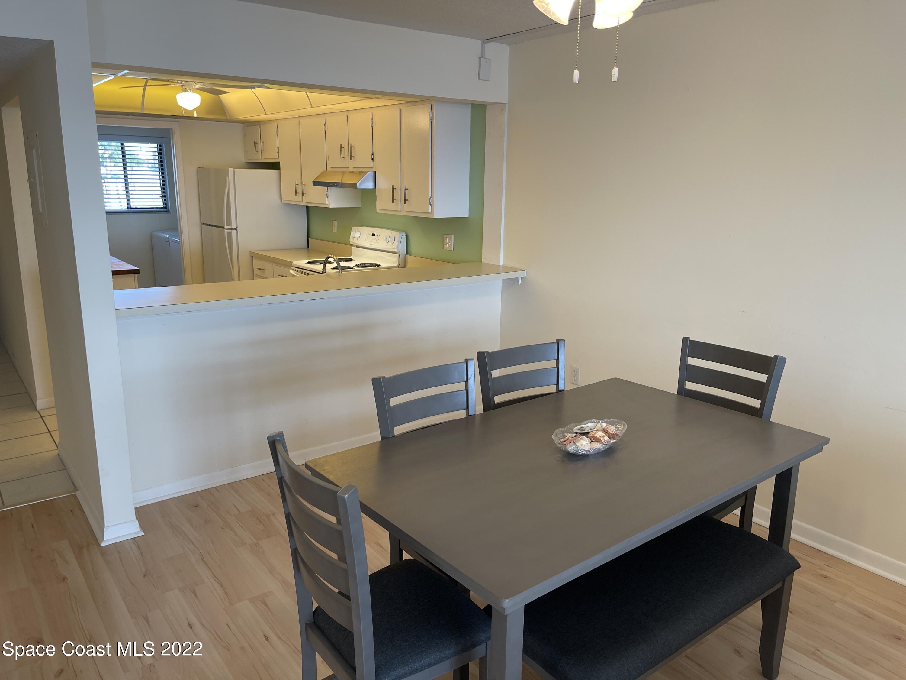 3799 South Banana River Boulevard, Unit 817 Cocoa Beach, FL 32931 - Photo 11 of 26 a view of a dining room with furniture