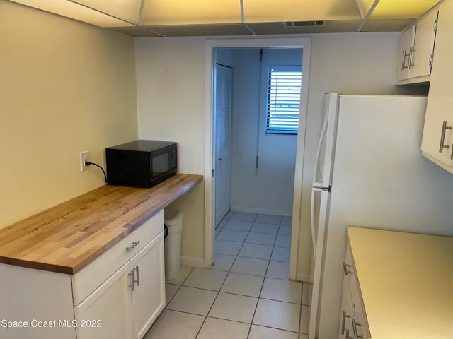 a kitchen with a stove and a refrigerator