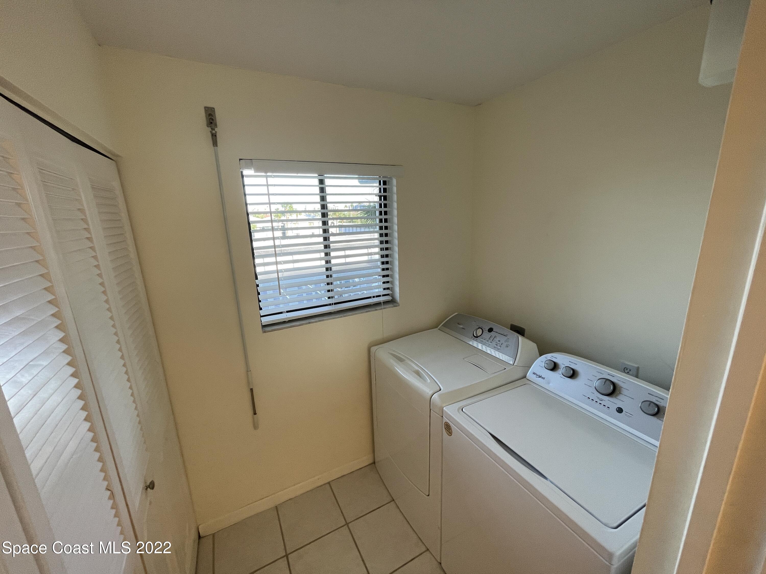 3799 South Banana River Boulevard, Unit 817 Cocoa Beach, FL 32931 - Photo 14 of 26 a utility room with dryer and washer