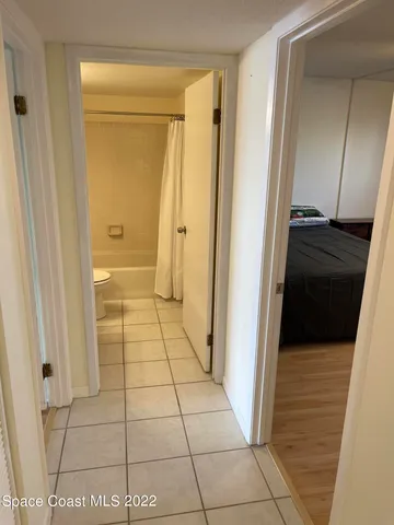 a bathroom with a glass door shower and a sink