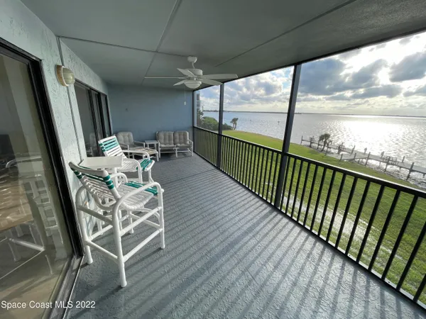 a view of balcony with furniture