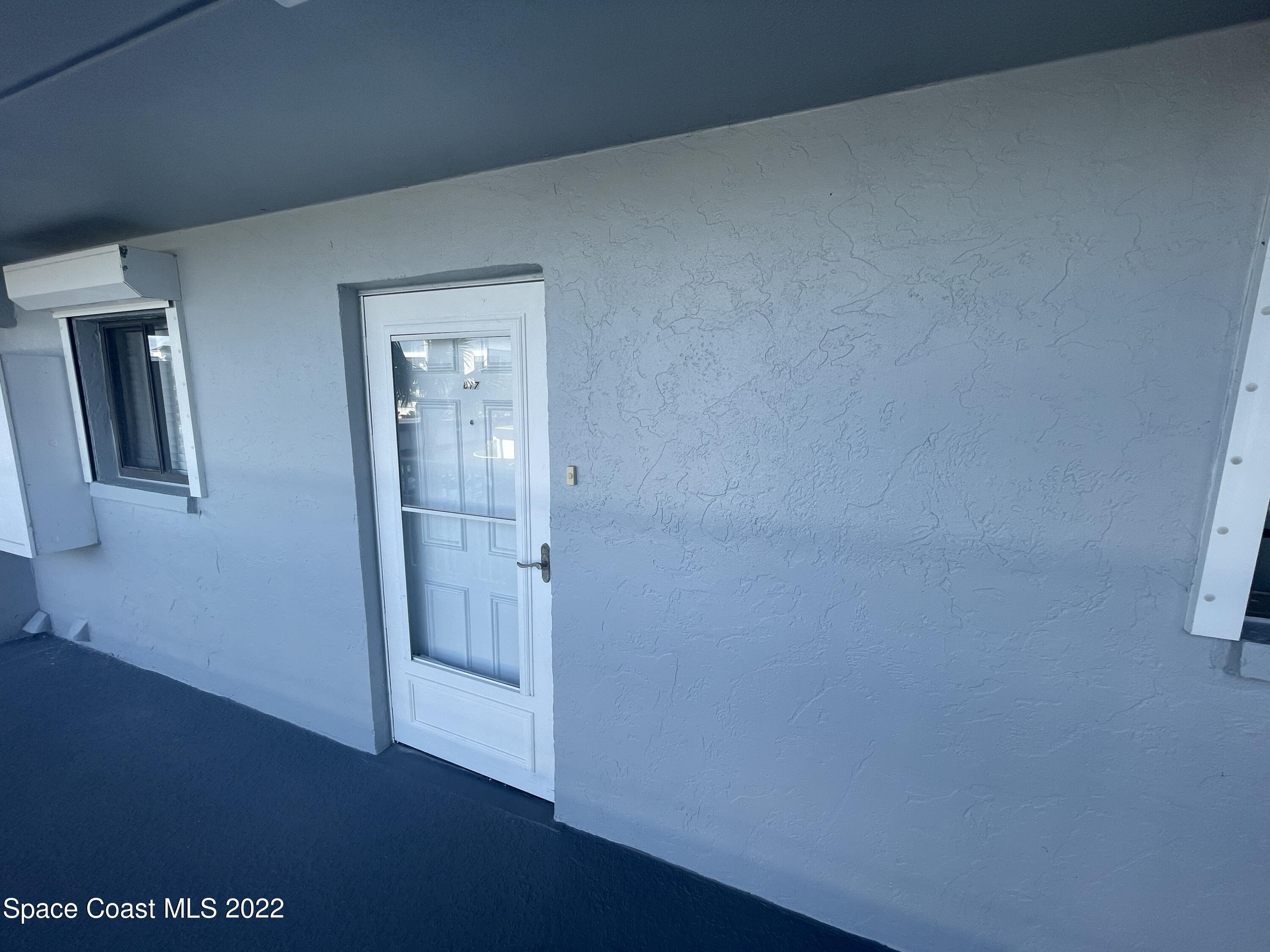 3799 South Banana River Boulevard, Unit 817 Cocoa Beach, FL 32931 - Photo 3 of 26 a view of hallway with front door