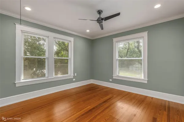 an empty room with wooden floor
