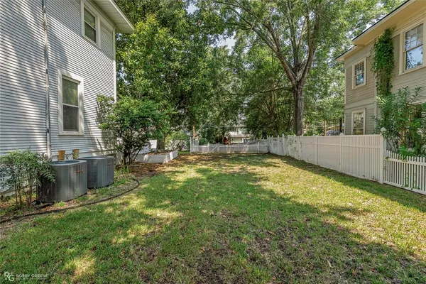 a view of a house with a backyard