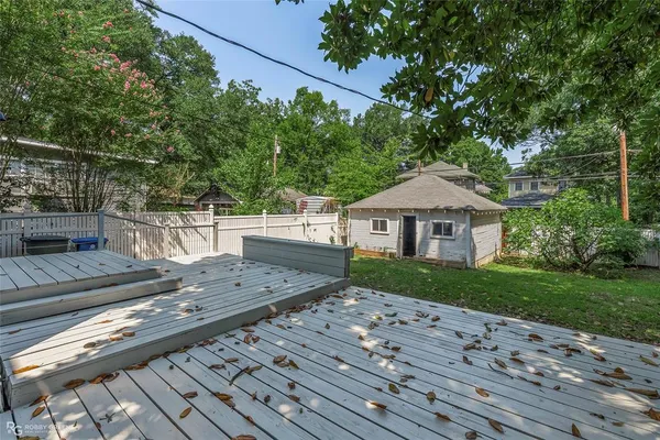 a view of a wooden deck and a yard