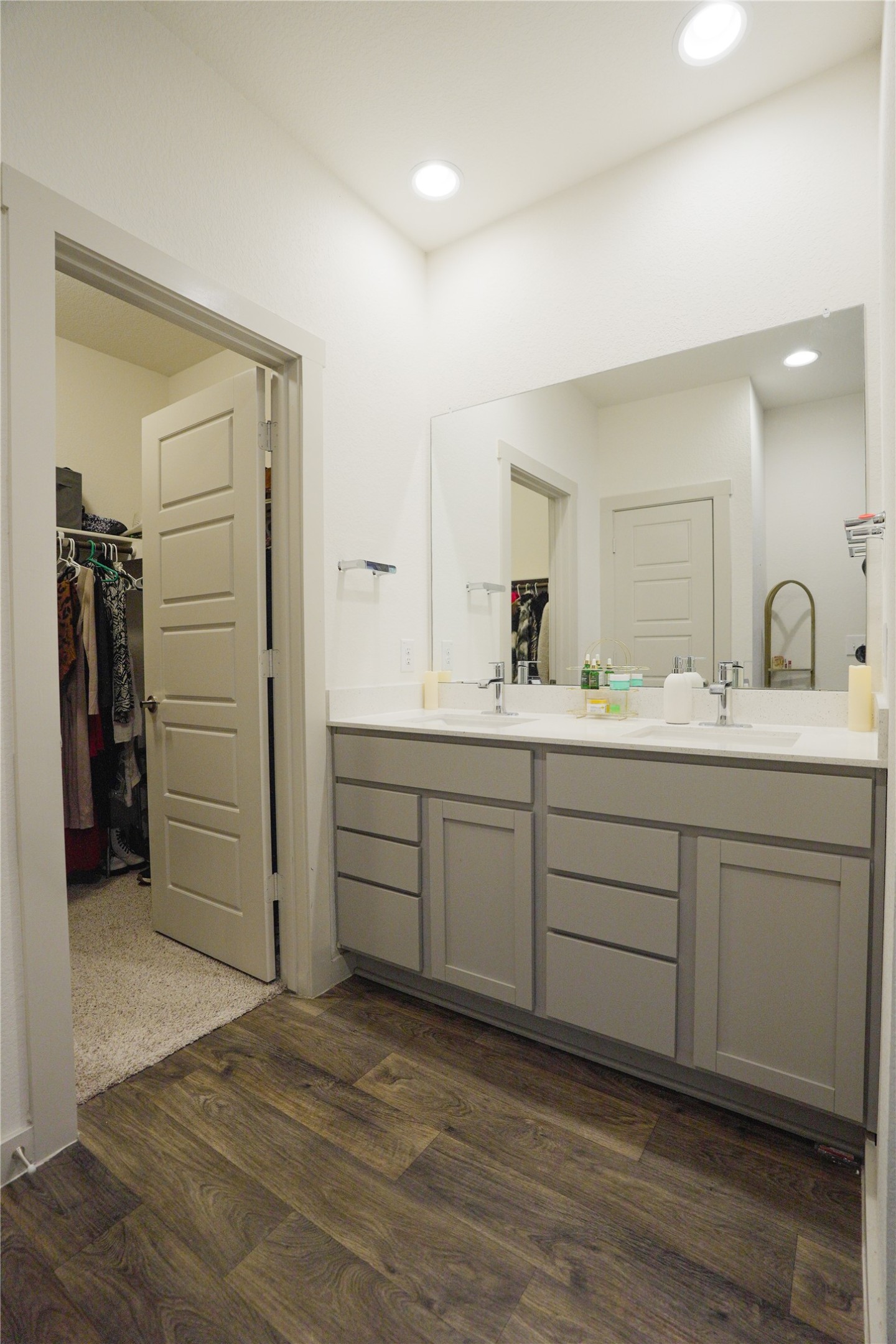 4605 Tully Drive Pflugerville, TX 78660 - Photo 10 of 38 a bathroom with a double vanity sink and a mirror