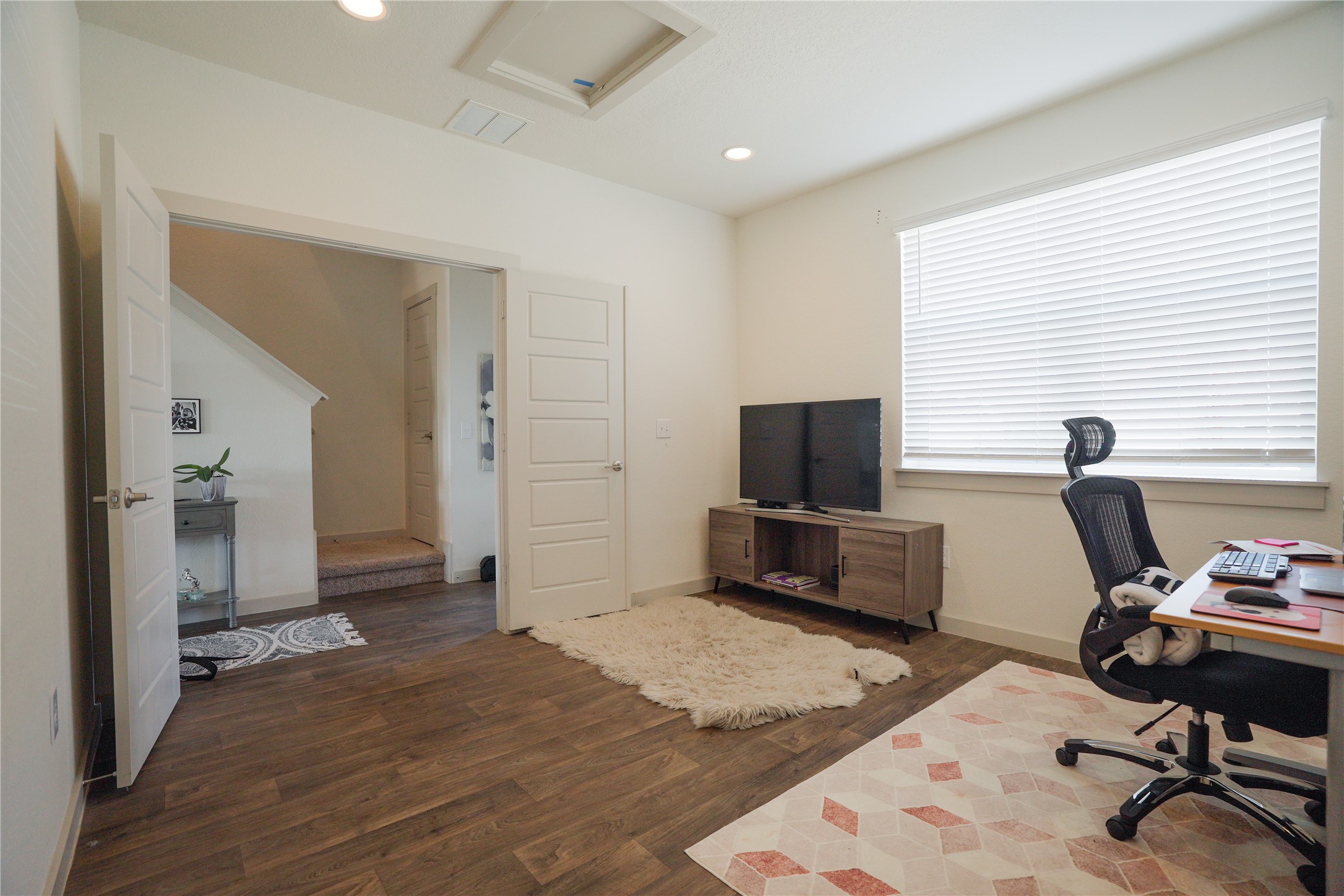 4605 Tully Drive Pflugerville, TX 78660 - Photo 18 of 38 a view of a livingroom with workspace and a window