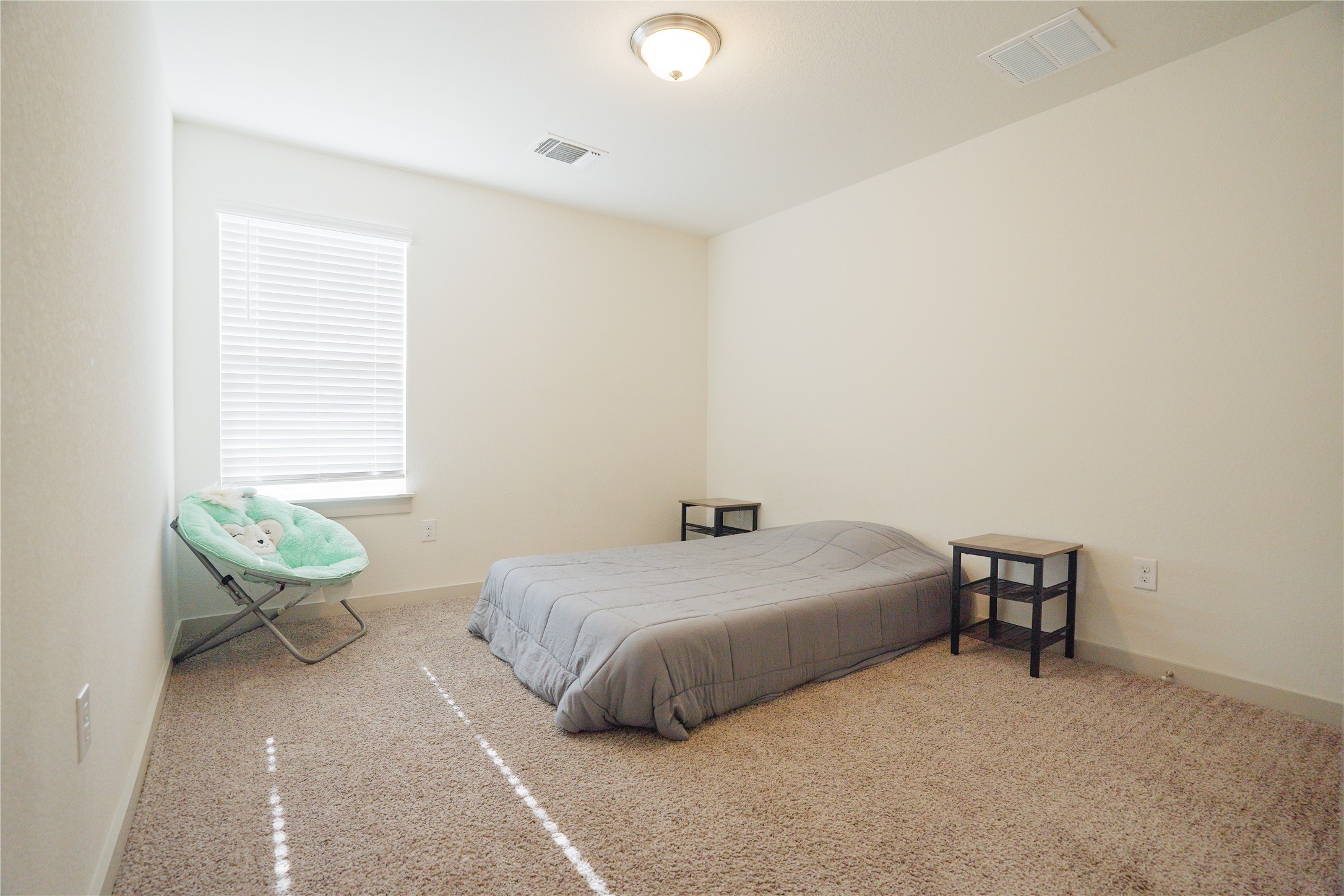 4605 Tully Drive Pflugerville, TX 78660 - Photo 24 of 38 a bedroom with a bed and a window