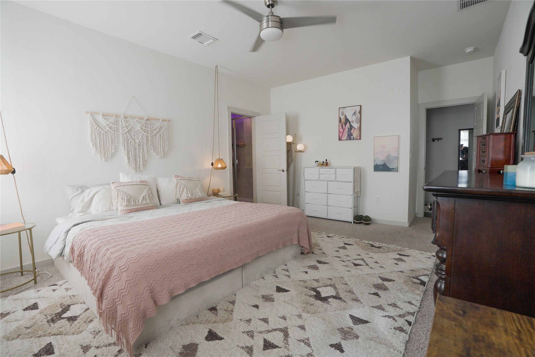 4605 Tully Drive Pflugerville, TX 78660 - Photo 4 of 38 a bedroom with a bed and a flat screen tv