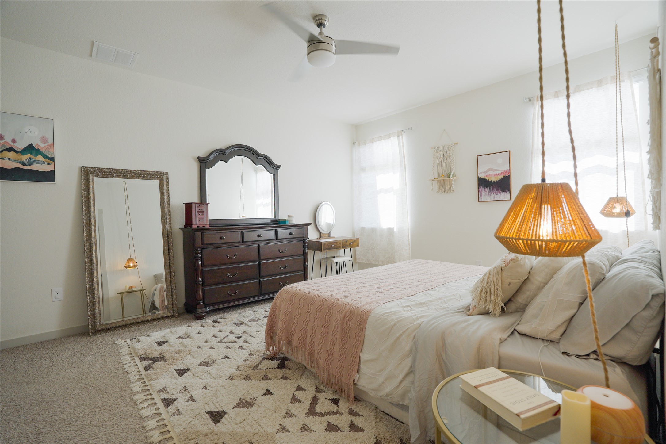 4605 Tully Drive Pflugerville, TX 78660 - Photo 8 of 38 a bedroom with a bed and a dresser next to a window