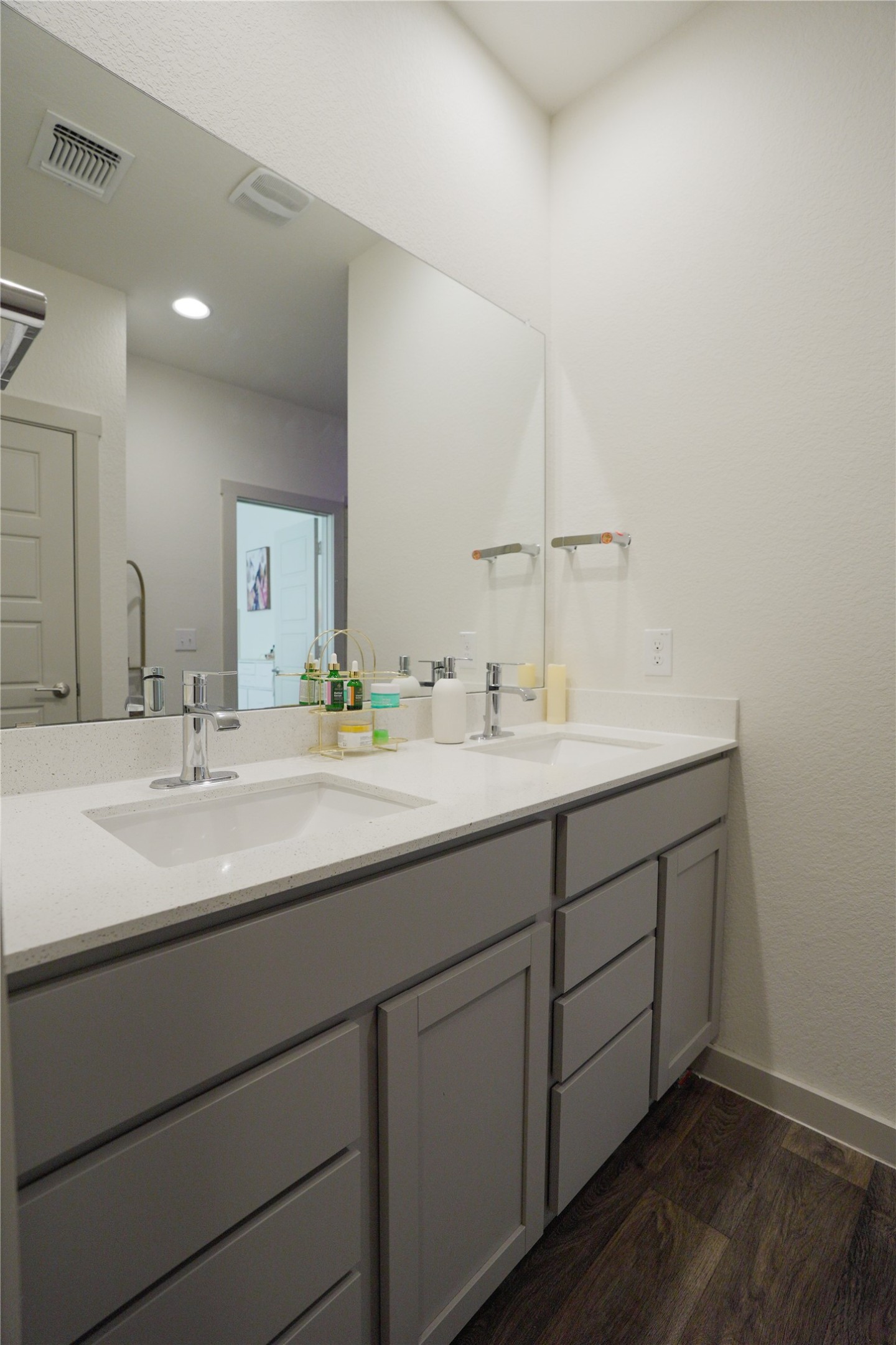 4605 Tully Drive Pflugerville, TX 78660 - Photo 9 of 38 a bathroom with a double vanity sink and a mirror