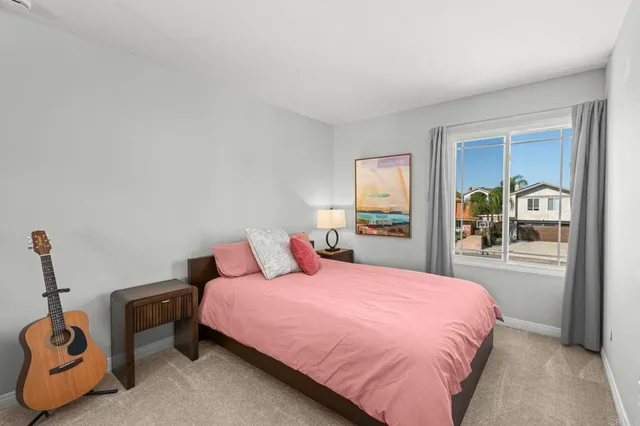 a bathroom with a granite countertop sink a mirror and a bathtub