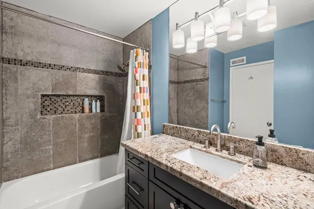 a dining room with table and chairs