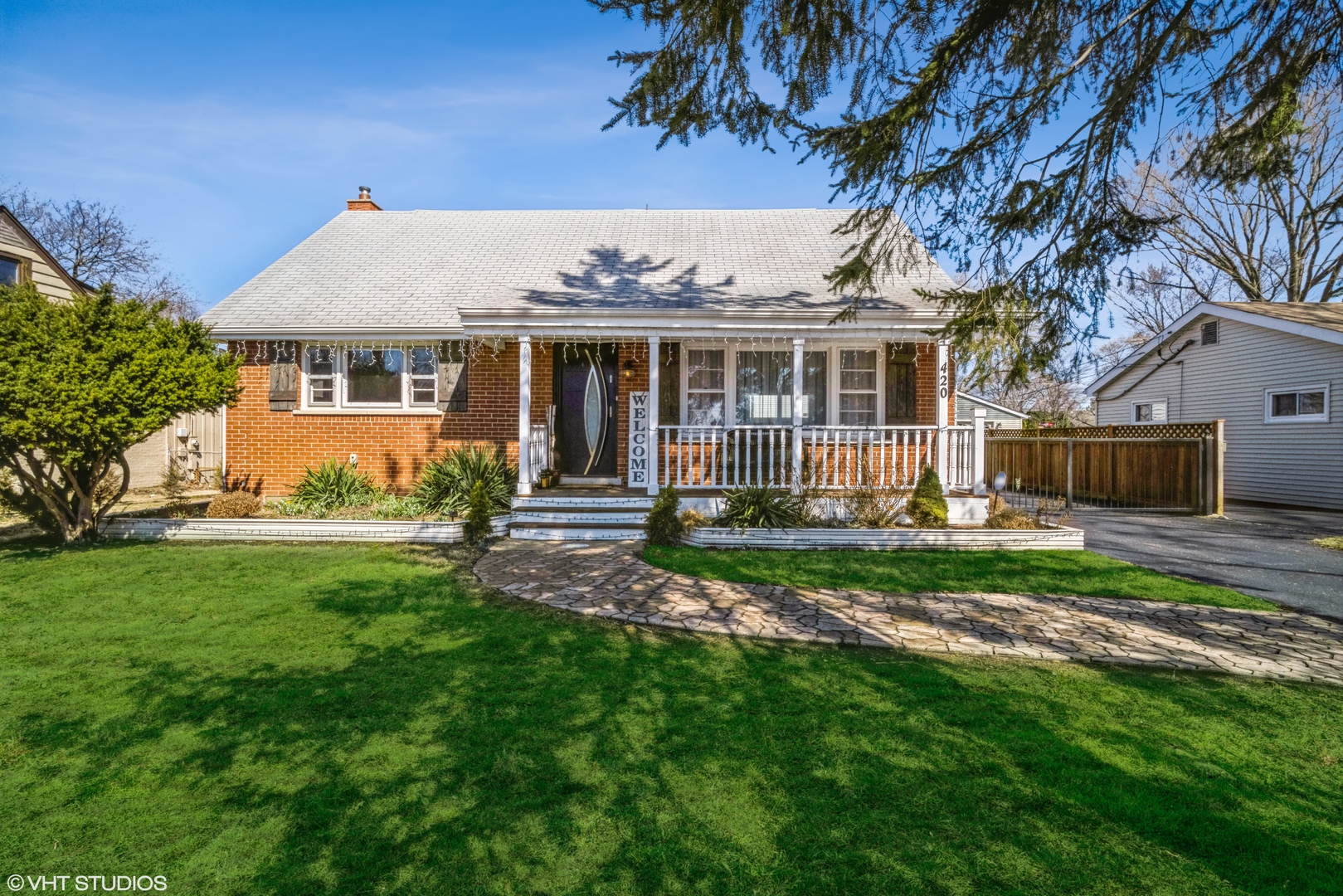 a front view of a house with garden