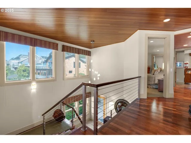 a view of a livingroom with furniture staircase and a fireplace