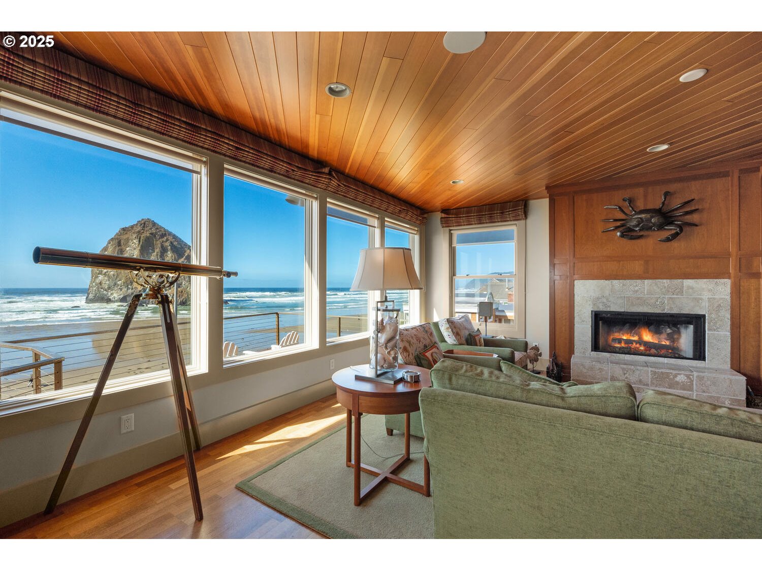 1880 Pacific Avenue Cannon Beach, OR 97110 - Photo 22 of 48 a living room with furniture a window and a fireplace